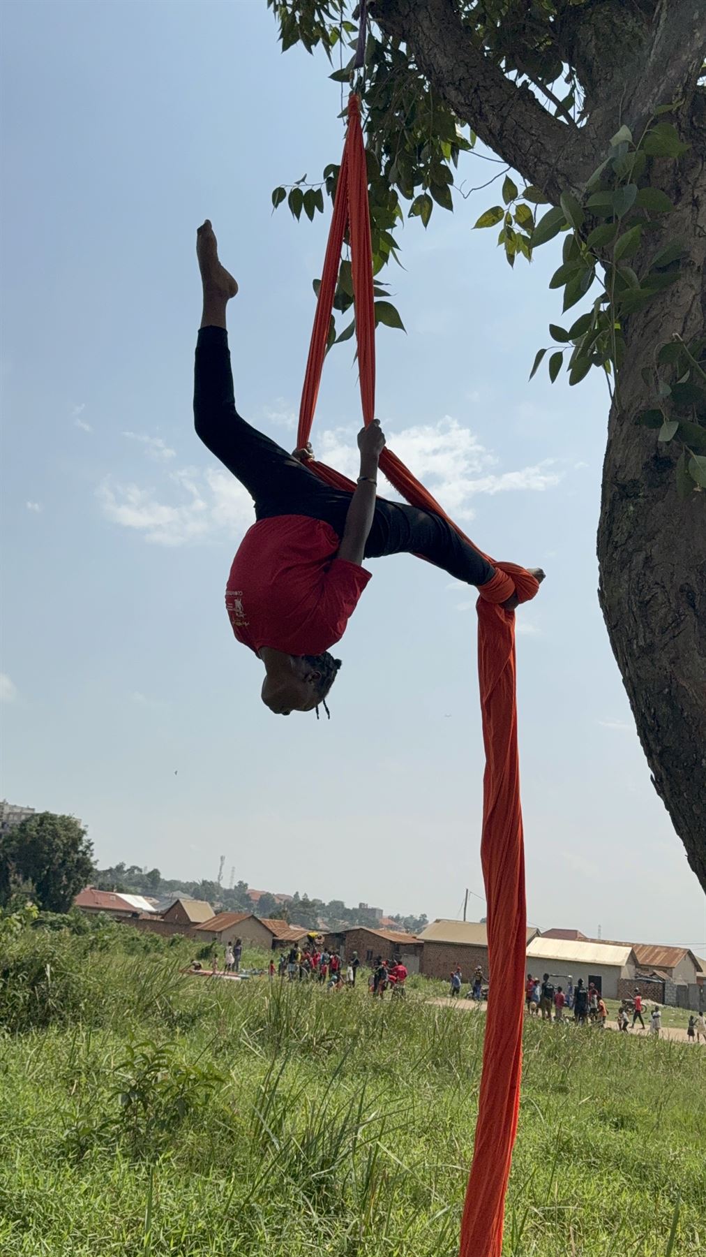Young people practising circus skills outdoors
