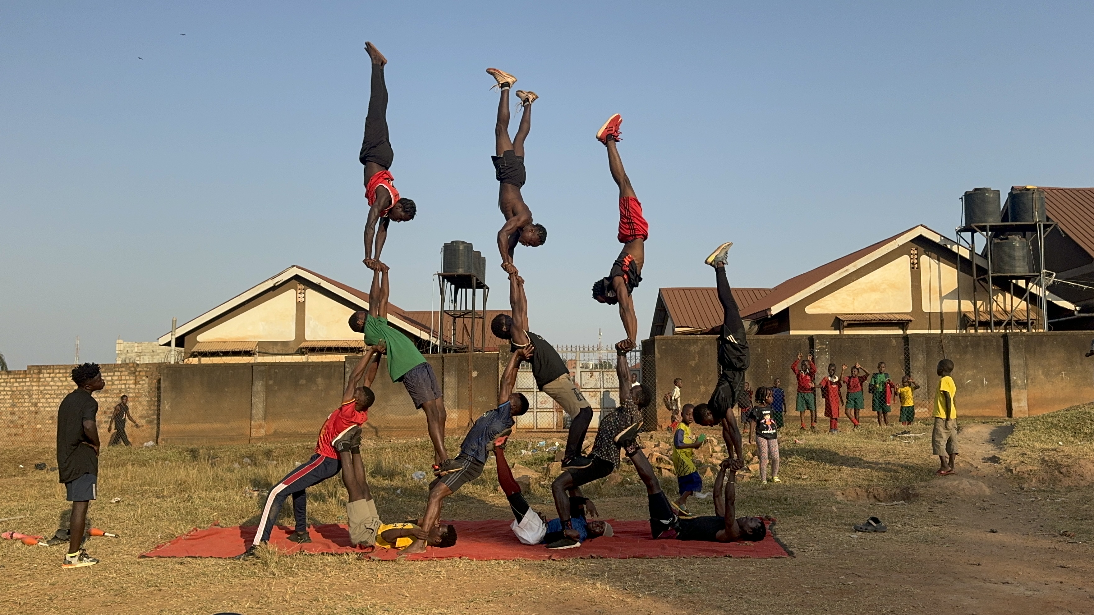 Young performers working together in a circus pyramid