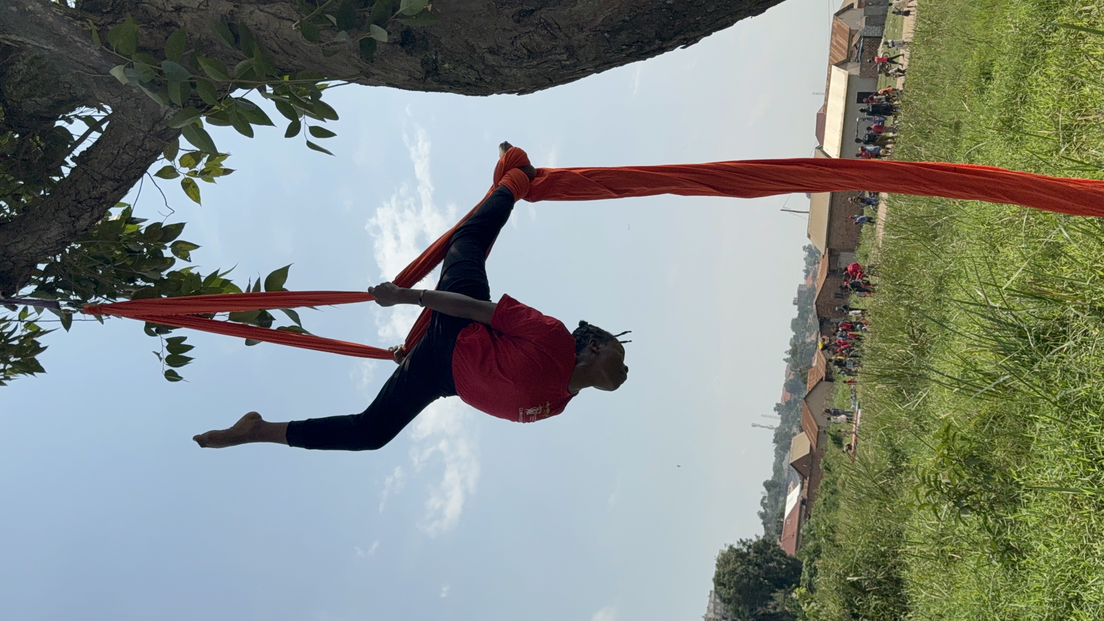 Young people practising circus skills outdoors